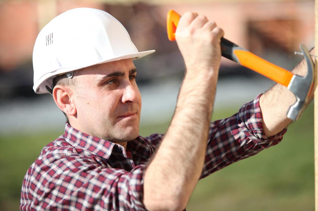 construction man plucking nail